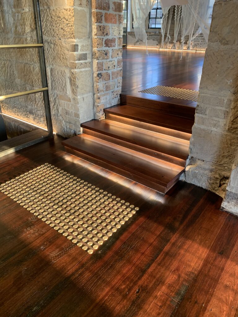 Timber stairs with LED lighting in a heritage sandstone building in Sydney by Vetra Group